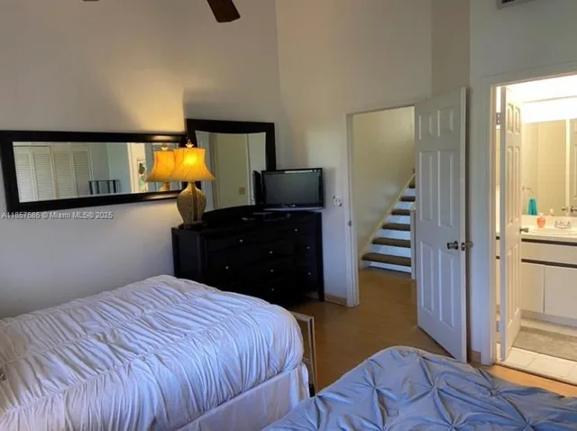 a bedroom with bed and window