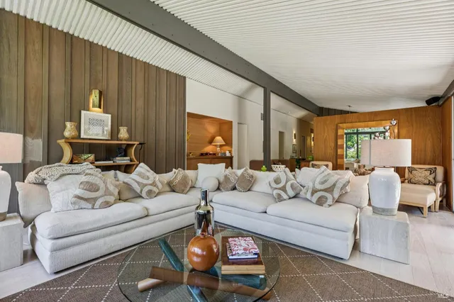 a bedroom with a bed dresser and a window