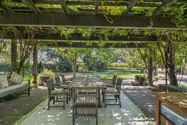 a kitchen with kitchen island a large window in it