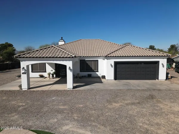 a front view of a house with a garage