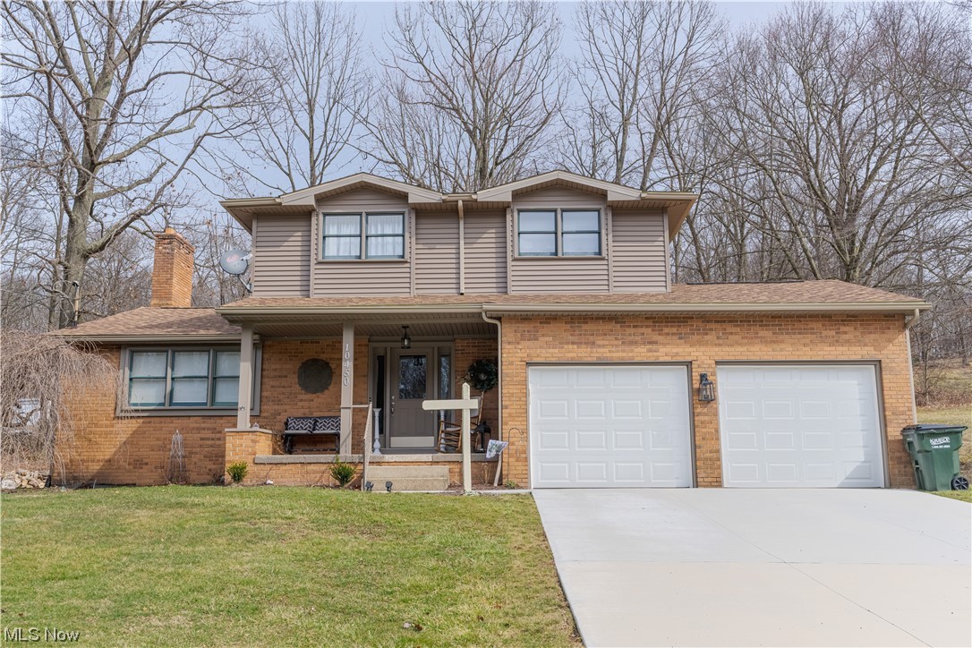10450 Gavers Road Hanoverton, OH 44423 - Photo 1 of 50 View of front of home featuring covered porch and a front yard