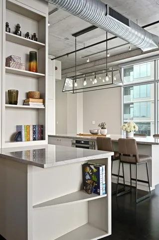 a kitchen with a stove and cabinets