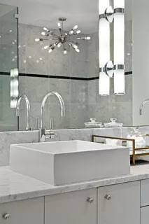 a bathroom with a sink double vanity and a mirror