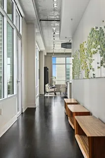 a kitchen with stove and wooden floor