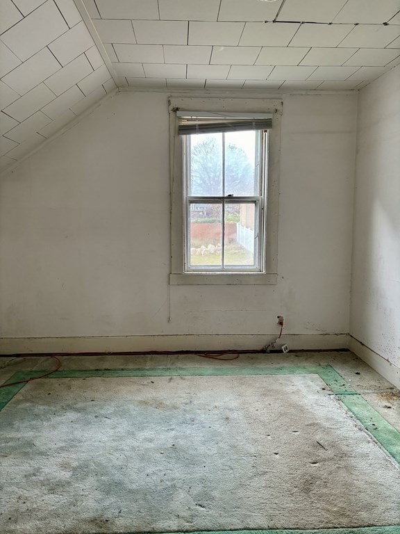 91 Smith Street Fall River, MA 02721 - Photo 16 of 23 an empty room with a window