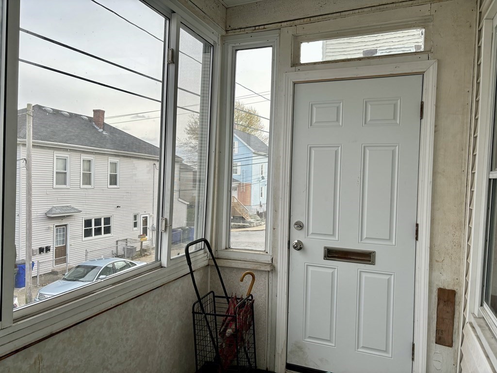 91 Smith Street Fall River, MA 02721 - Photo 4 of 23 a view of a room with gym equipment