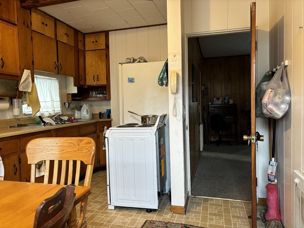 91 Smith Street Fall River, MA 02721 - Photo 6 of 23 a view of living room with furniture and a flat screen tv