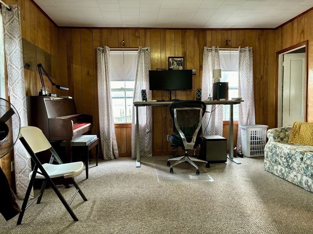 91 Smith Street Fall River, MA 02721 - Photo 10 of 23 a view of a livingroom with furniture and a flat screen tv