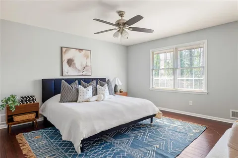 a bedroom with bed and a window