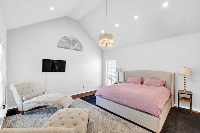 a bedroom with a bed and a couch