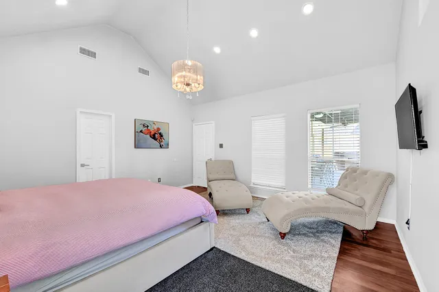 a bedroom with a bed and furniture