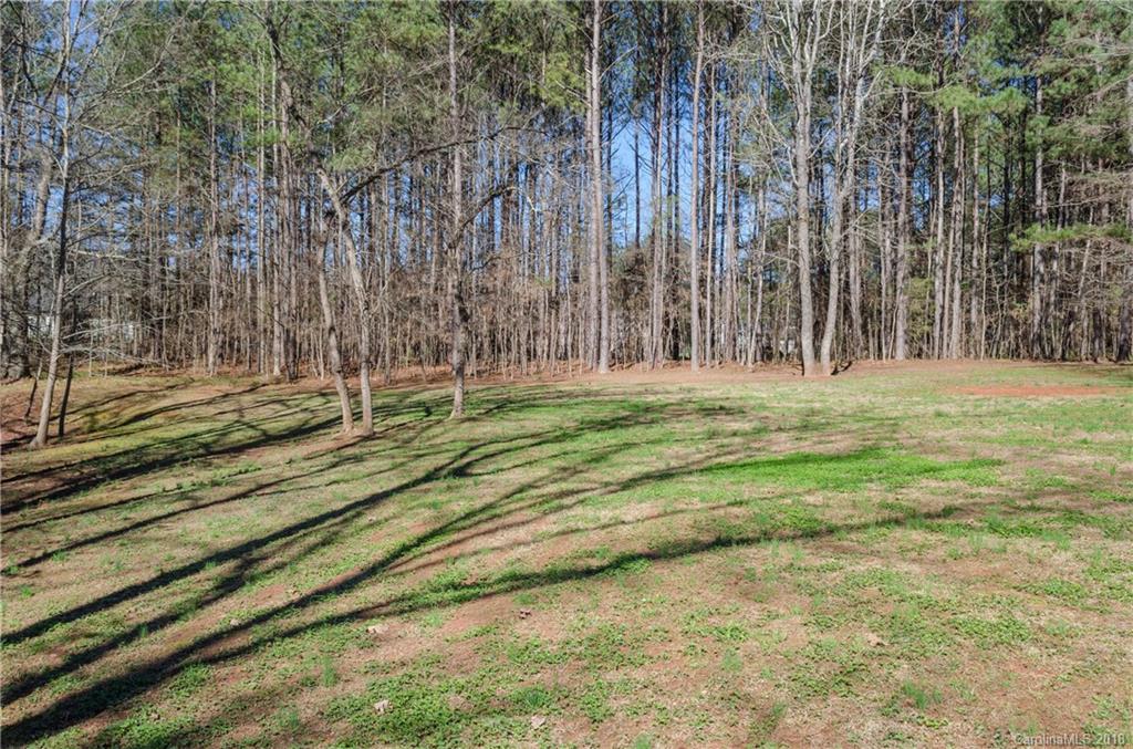 2110 State Rd S-46-168, Unit 25 York, SC 29745 - Photo 15 of 31 a big yard with lots of green space and trees
