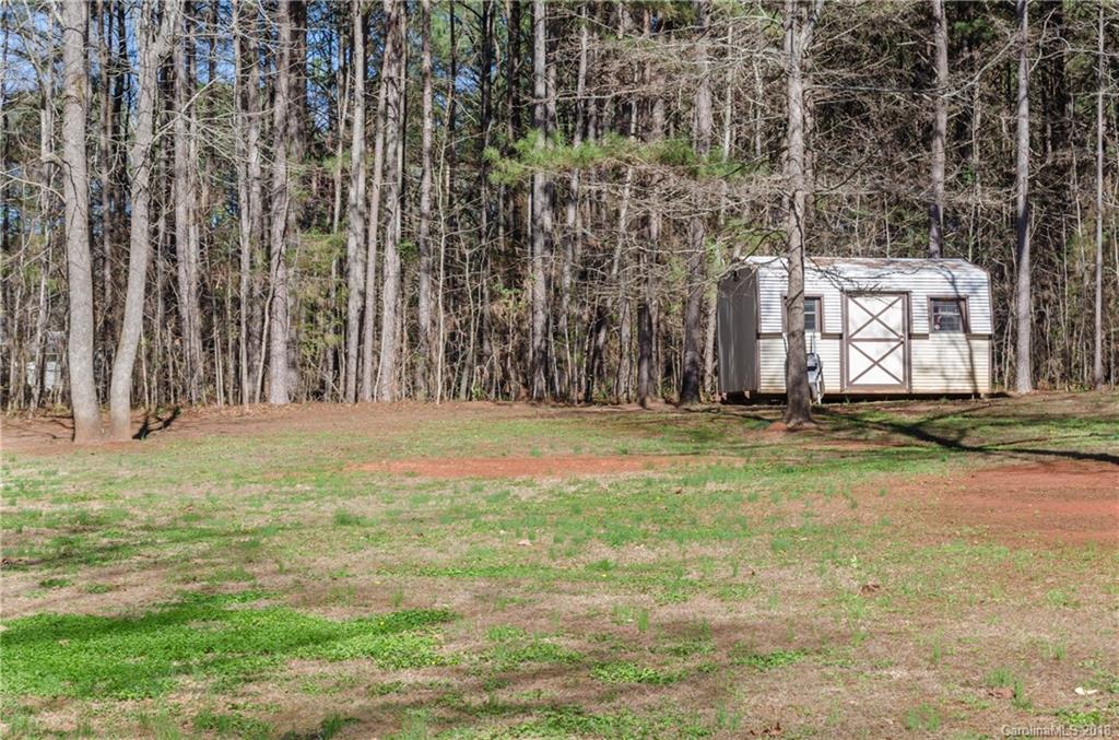 2110 State Rd S-46-168, Unit 25 York, SC 29745 - Photo 16 of 31 a view of a backyard of the house