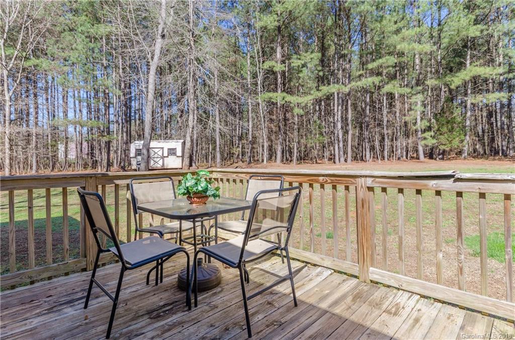 2110 State Rd S-46-168, Unit 25 York, SC 29745 - Photo 17 of 31 a view of a chairs and table on the wooden deck