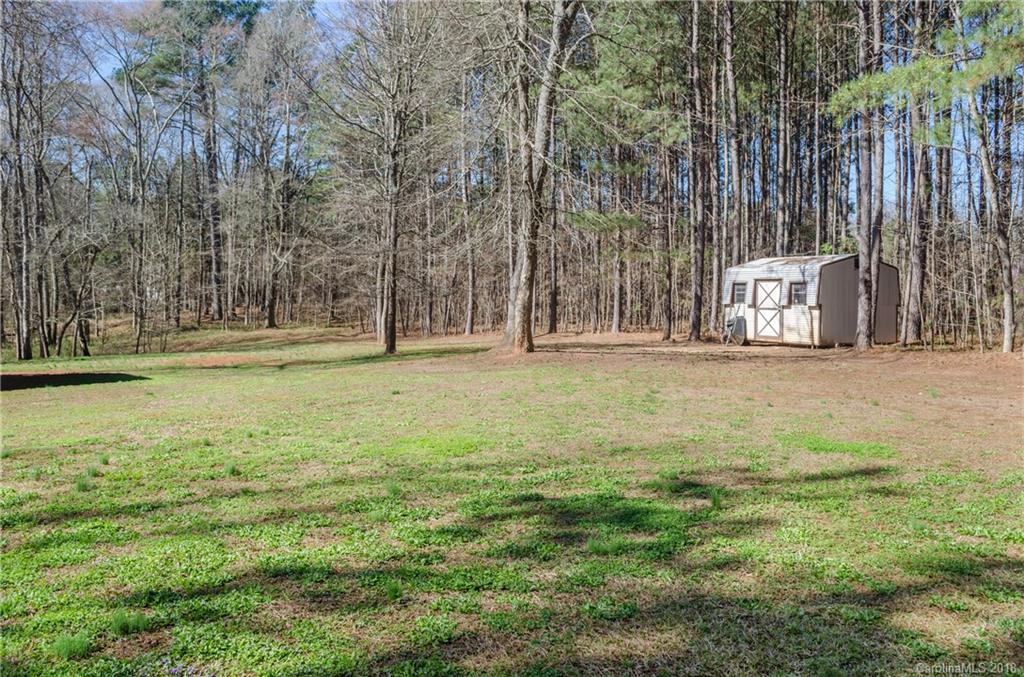 2110 State Rd S-46-168, Unit 25 York, SC 29745 - Photo 20 of 31 a building with trees in the background