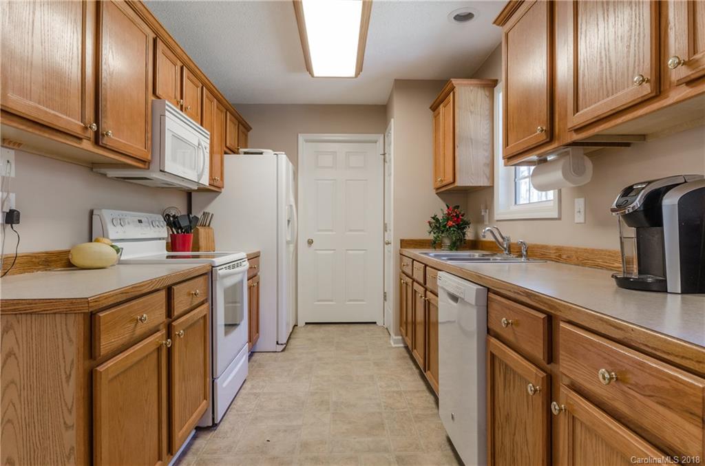 2110 State Rd S-46-168, Unit 25 York, SC 29745 - Photo 3 of 31 a kitchen with stainless steel appliances granite countertop a sink and cabinets