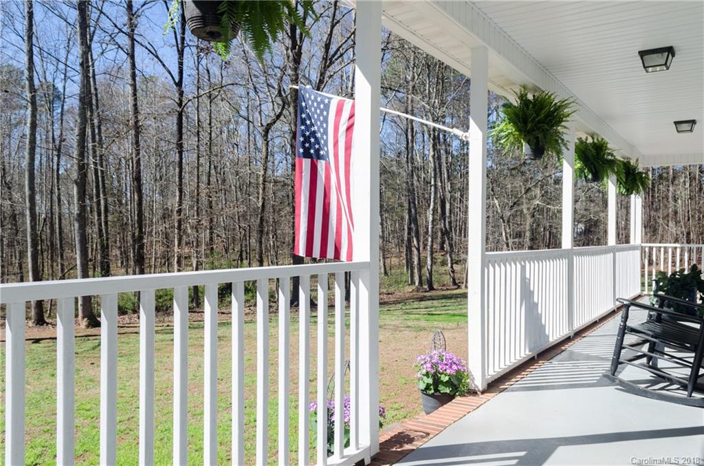 2110 State Rd S-46-168, Unit 25 York, SC 29745 - Photo 23 of 31 a view of a house with a small yard and floor to ceiling window
