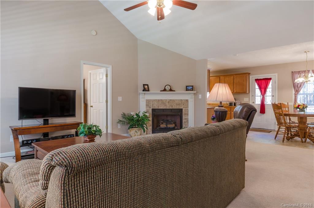 2110 State Rd S-46-168, Unit 25 York, SC 29745 - Photo 25 of 31 a living room with furniture and a flat screen tv