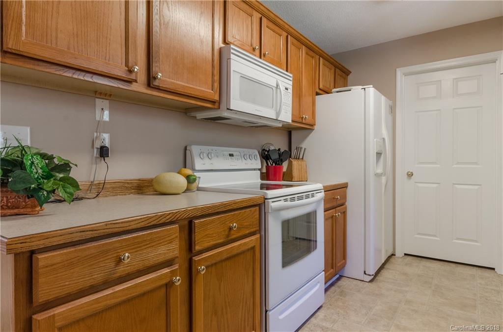 2110 State Rd S-46-168, Unit 25 York, SC 29745 - Photo 5 of 31 a kitchen with stainless steel appliances granite countertop a refrigerator and a stove top oven