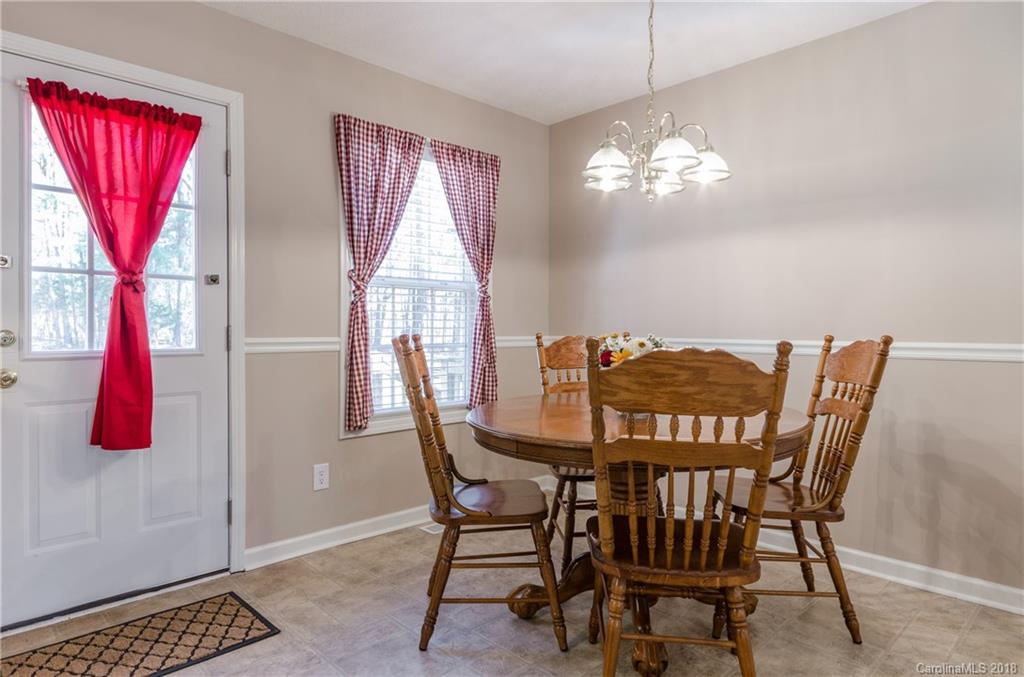2110 State Rd S-46-168, Unit 25 York, SC 29745 - Photo 7 of 31 a view of a dining room with furniture and wooden floor