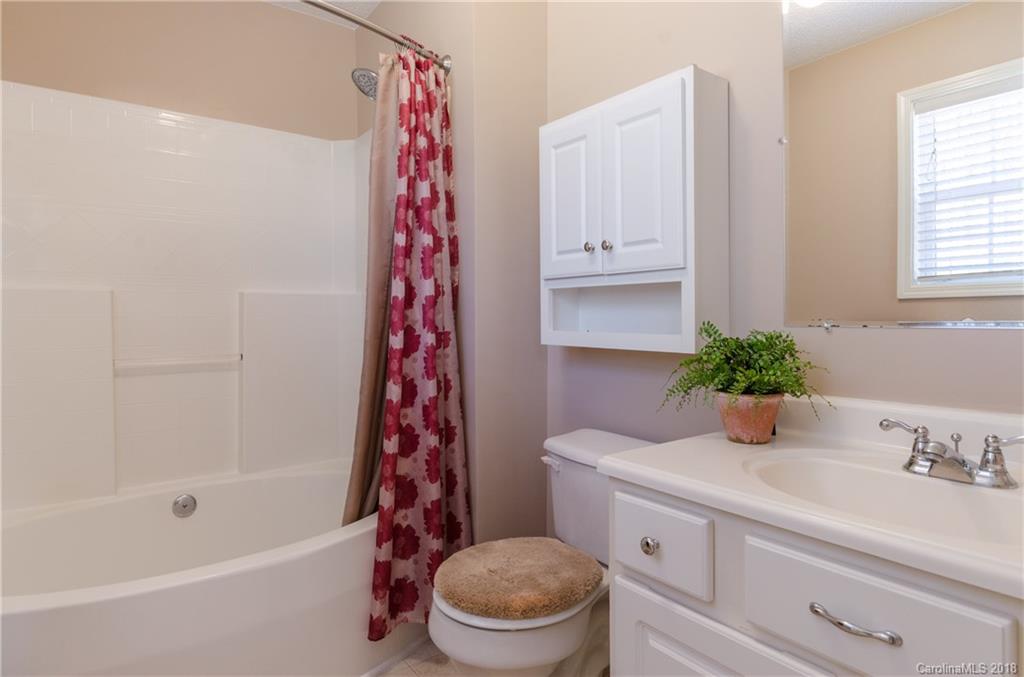2110 State Rd S-46-168, Unit 25 York, SC 29745 - Photo 10 of 31 a bathroom with a sink a toilet and shower