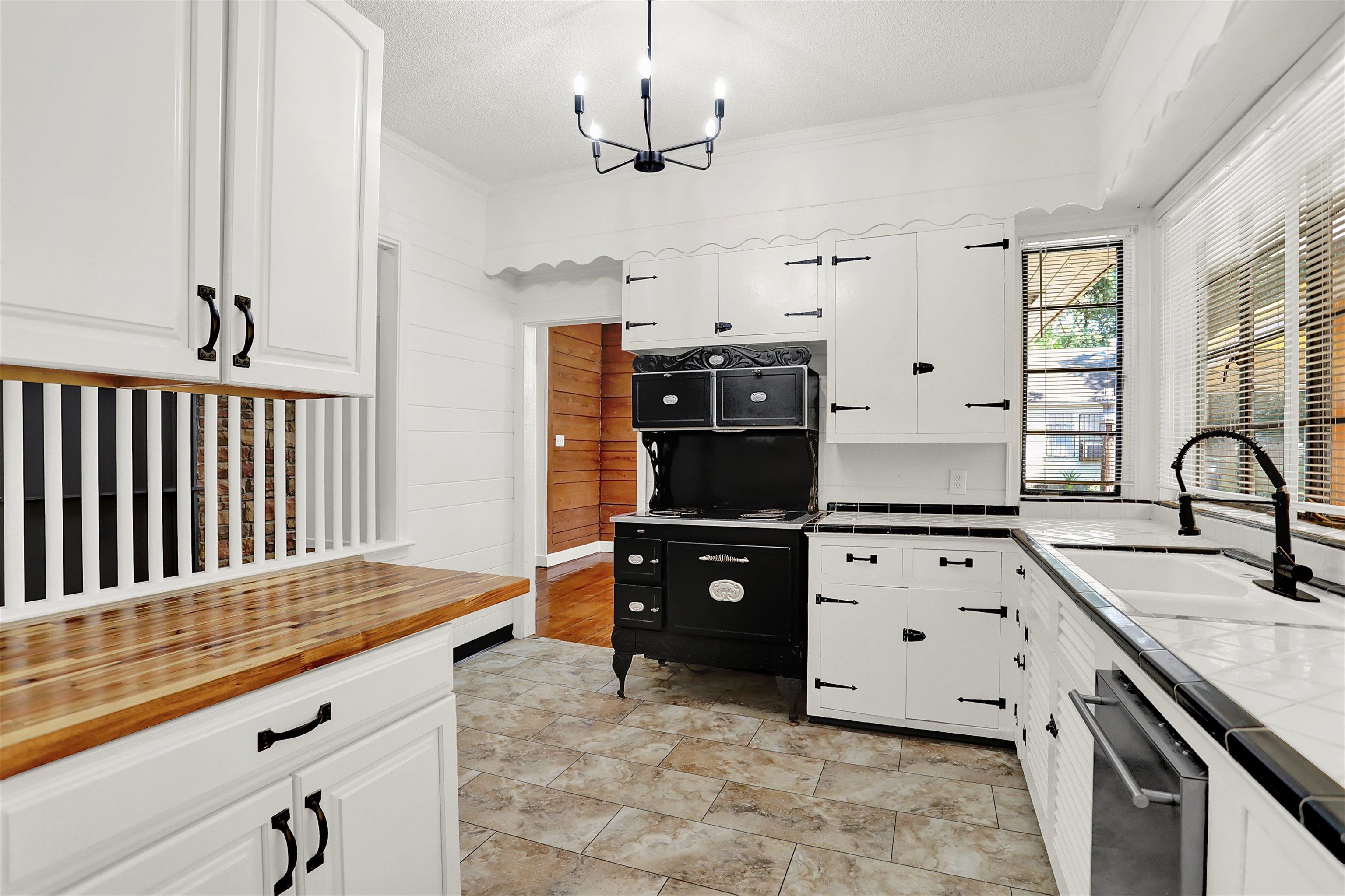 3618 Prescott Road Memphis, TN 38118 - Photo 11 of 20 a kitchen with stainless steel appliances kitchen island granite countertop a stove a sink and a refrigerator