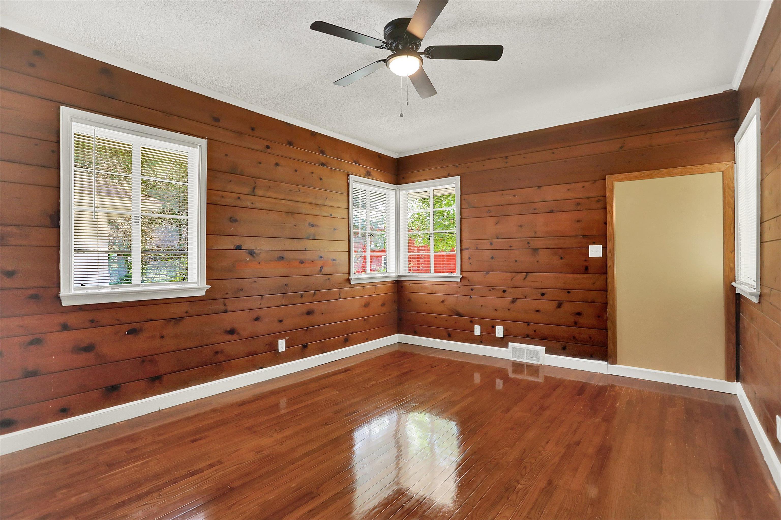 3618 Prescott Road Memphis, TN 38118 - Photo 15 of 20 a view of an empty room with window and wooden floor