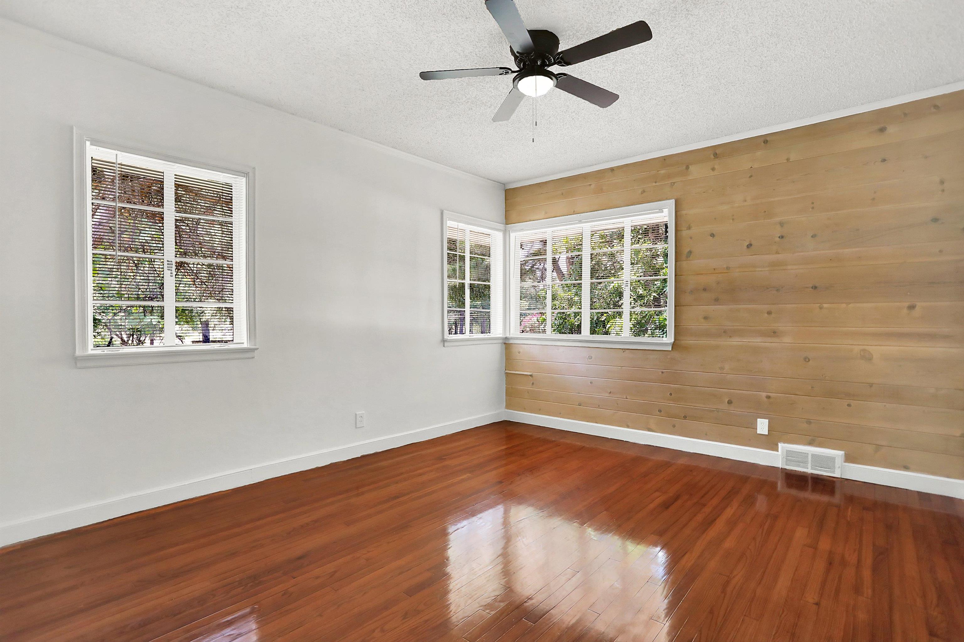 3618 Prescott Road Memphis, TN 38118 - Photo 17 of 20 a view of an empty room with wooden floor and a window