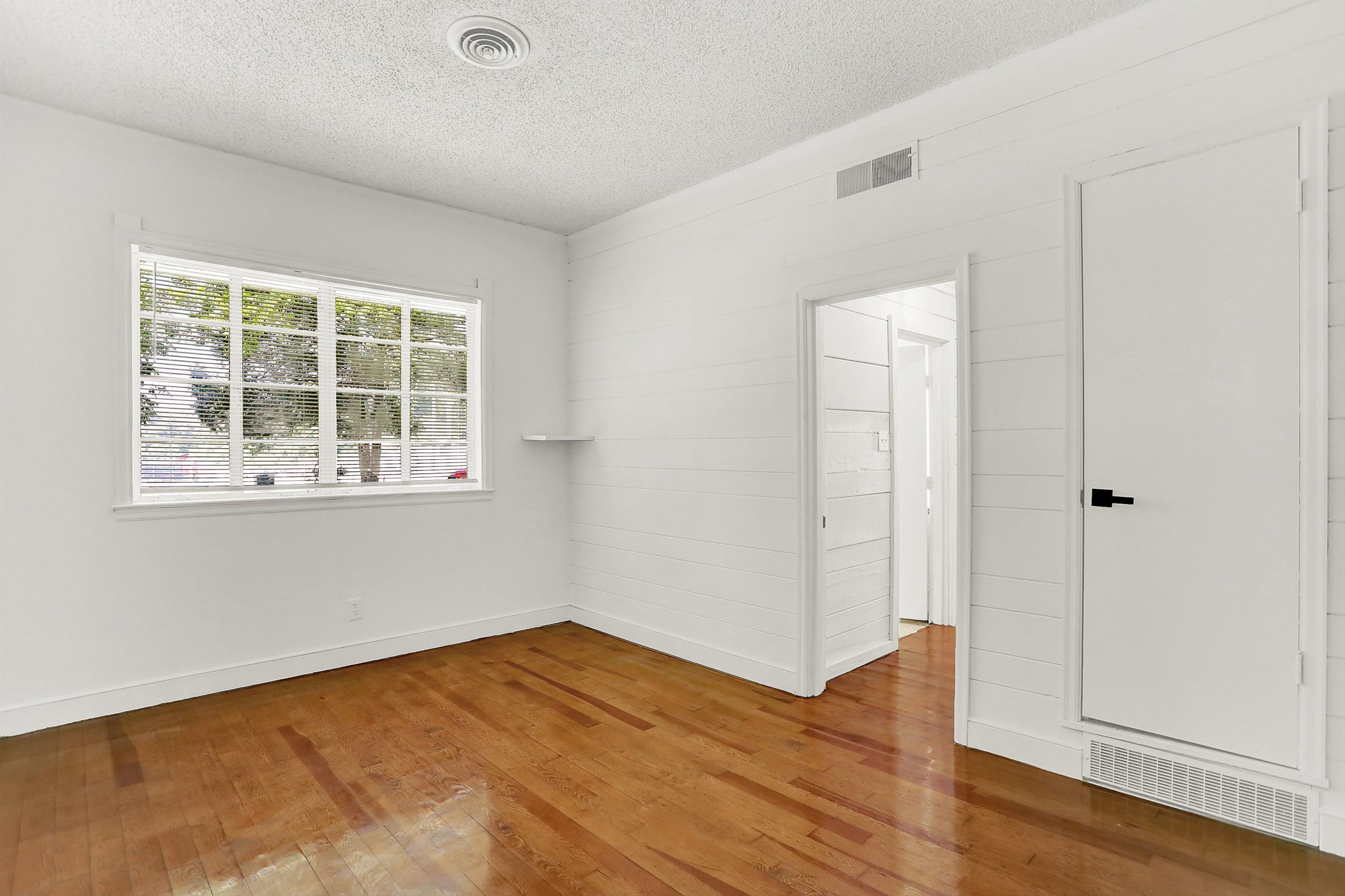 3618 Prescott Road Memphis, TN 38118 - Photo 2 of 20 a view of empty room with wooden floor and fan