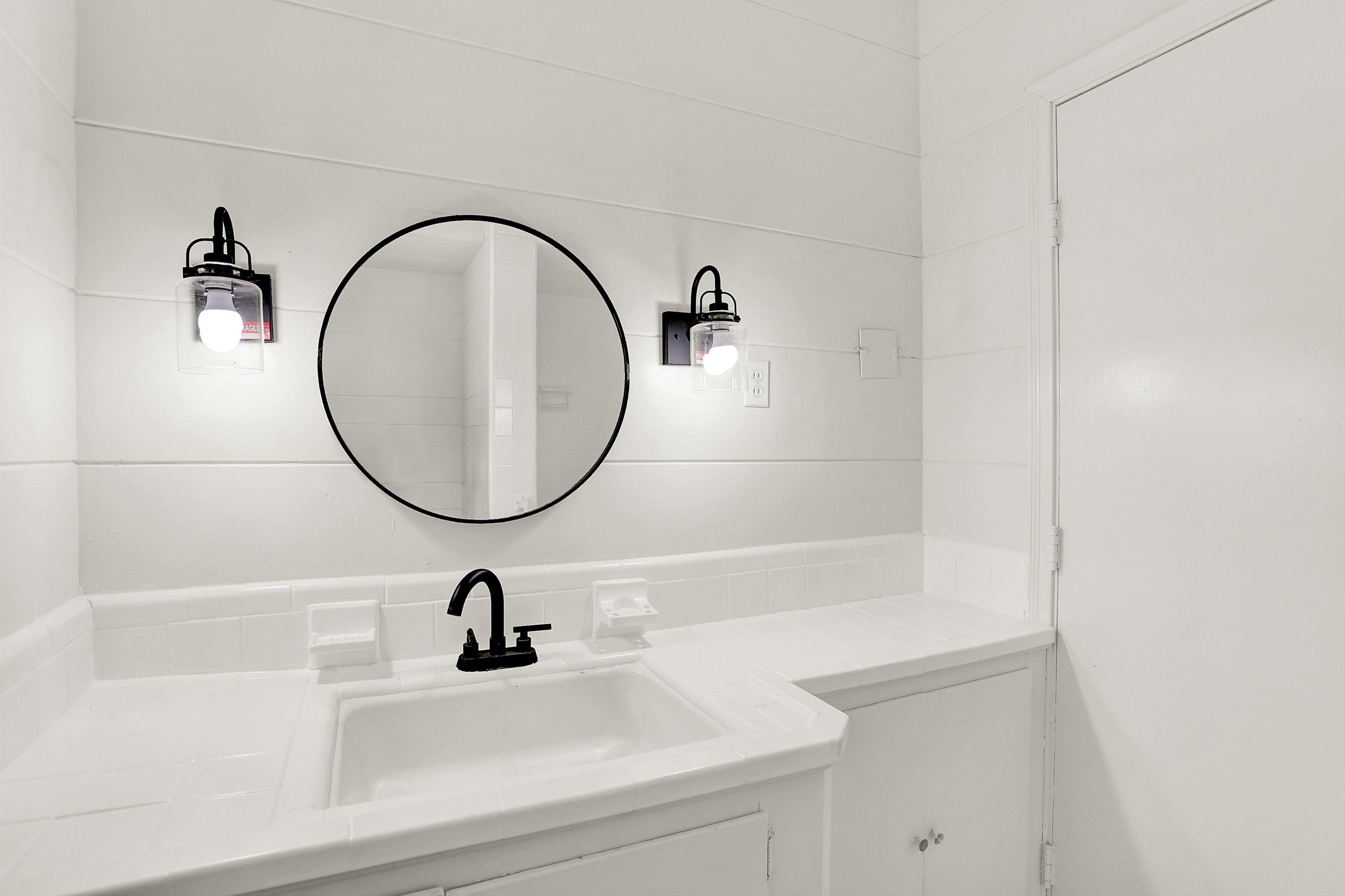 3618 Prescott Road Memphis, TN 38118 - Photo 4 of 20 a bathroom with a sink and a mirror