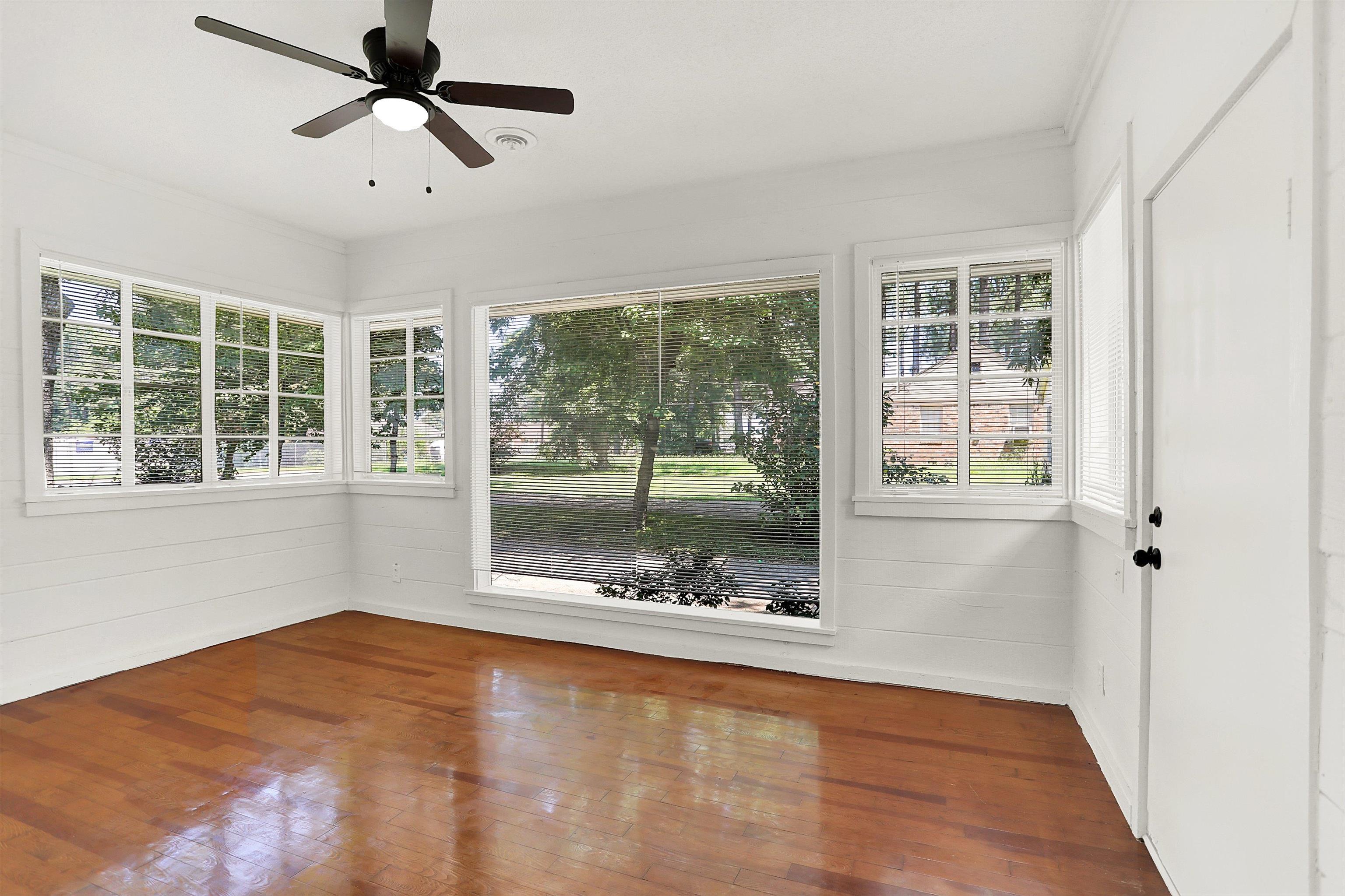 3618 Prescott Road Memphis, TN 38118 - Photo 5 of 20 a view of empty room with wooden floor and fan