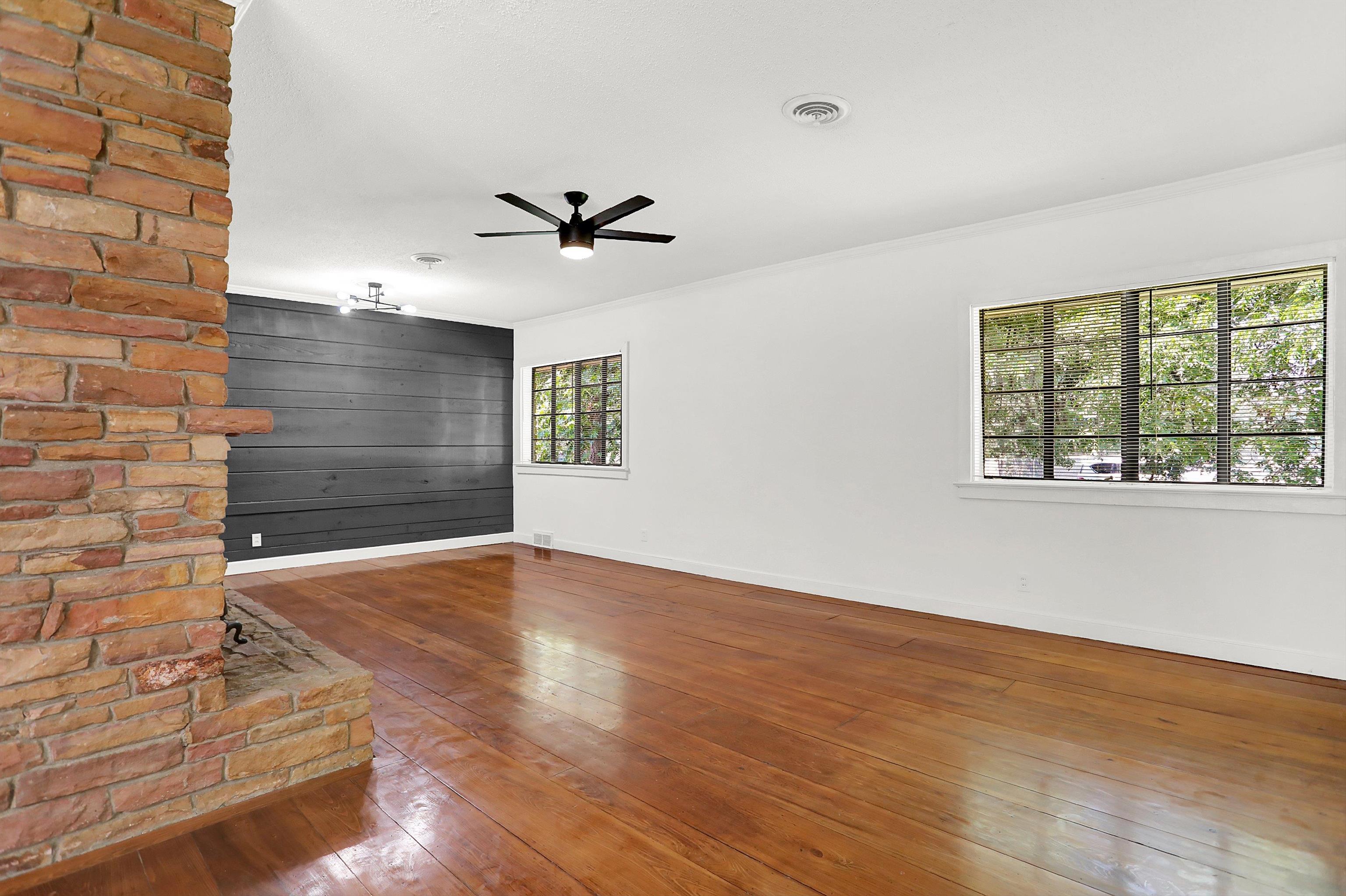 3618 Prescott Road Memphis, TN 38118 - Photo 6 of 20 a view of empty room with wooden floor and fan