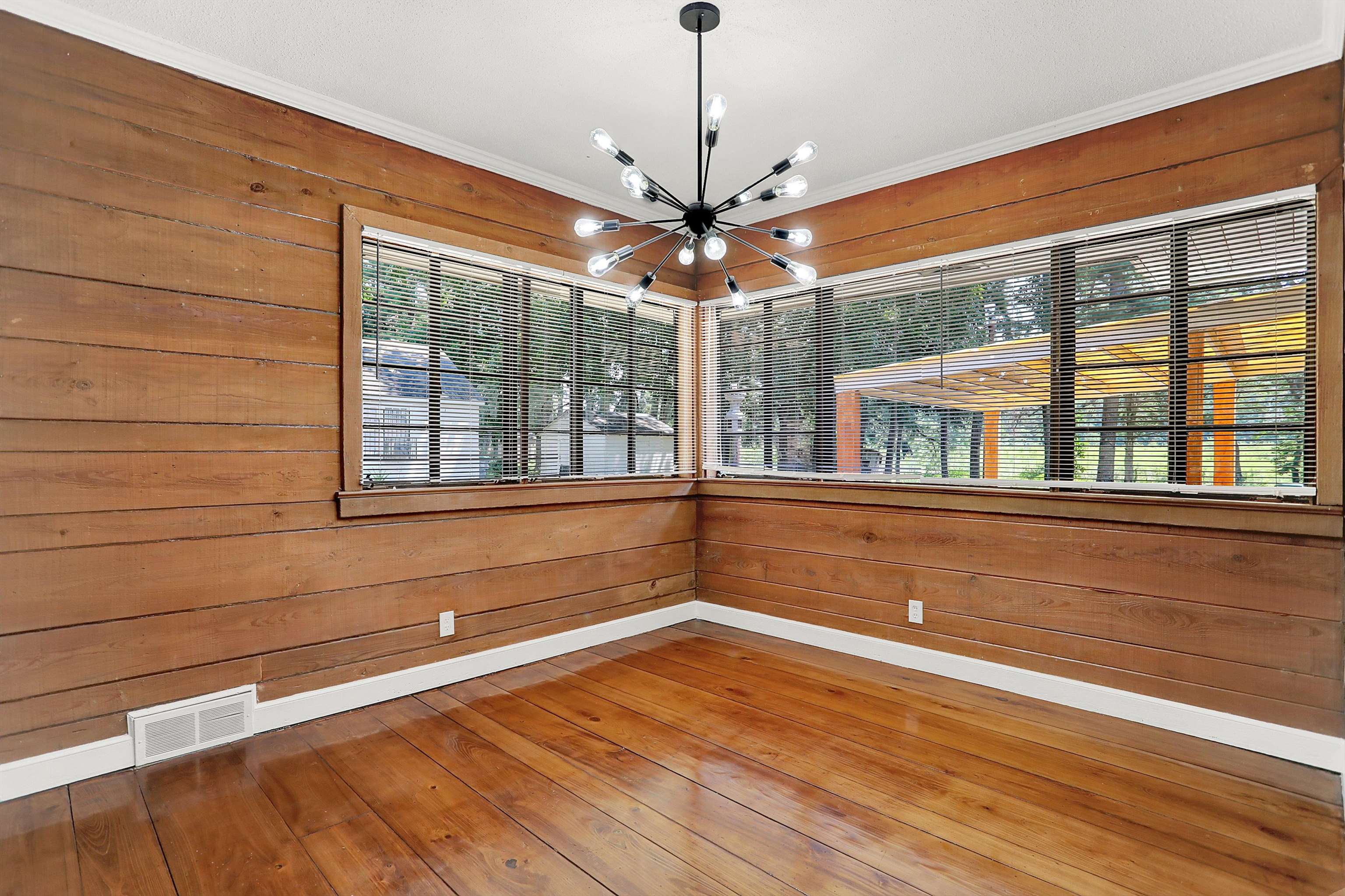 3618 Prescott Road Memphis, TN 38118 - Photo 8 of 20 a view of an empty room with a window and wooden floor