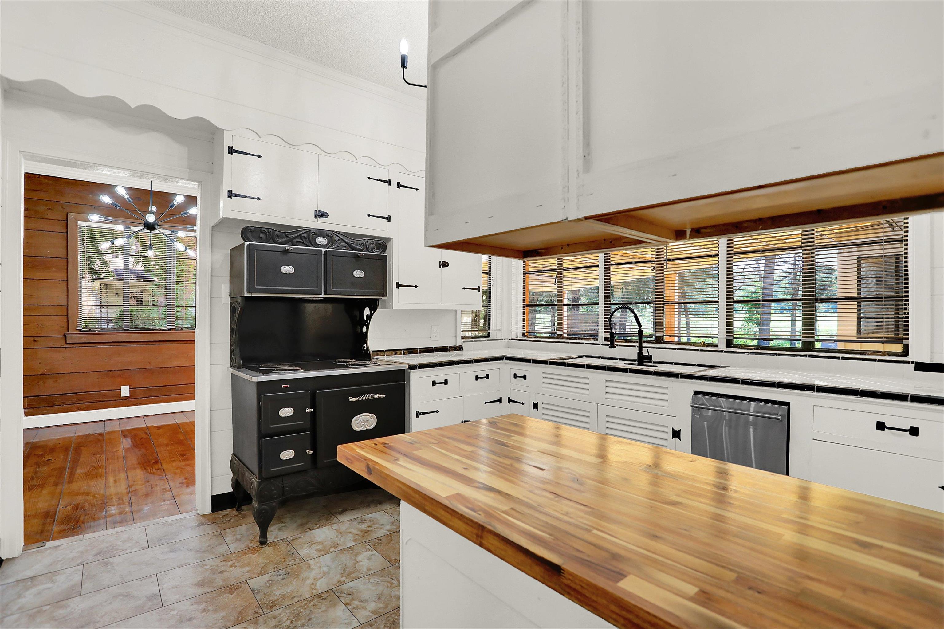 3618 Prescott Road Memphis, TN 38118 - Photo 10 of 20 a kitchen with stainless steel appliances wooden cabinets a stove and a refrigerator