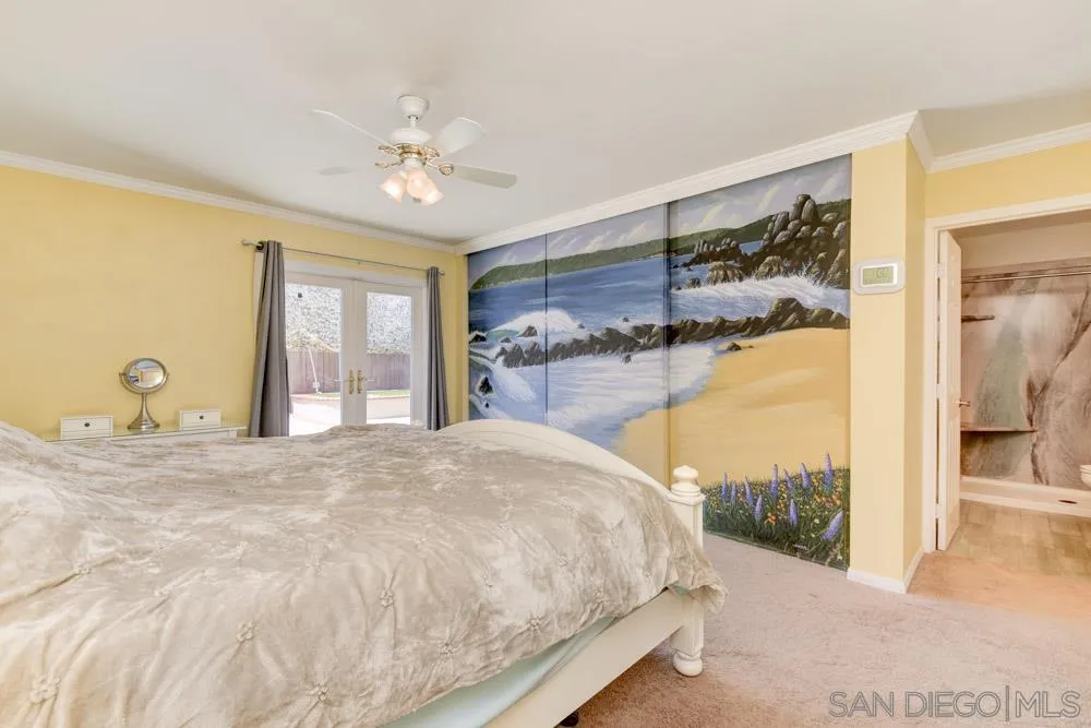 13008 Acton Avenue Poway, CA 92064 - Photo 12 of 28 a bedroom with a bed and a chandelier