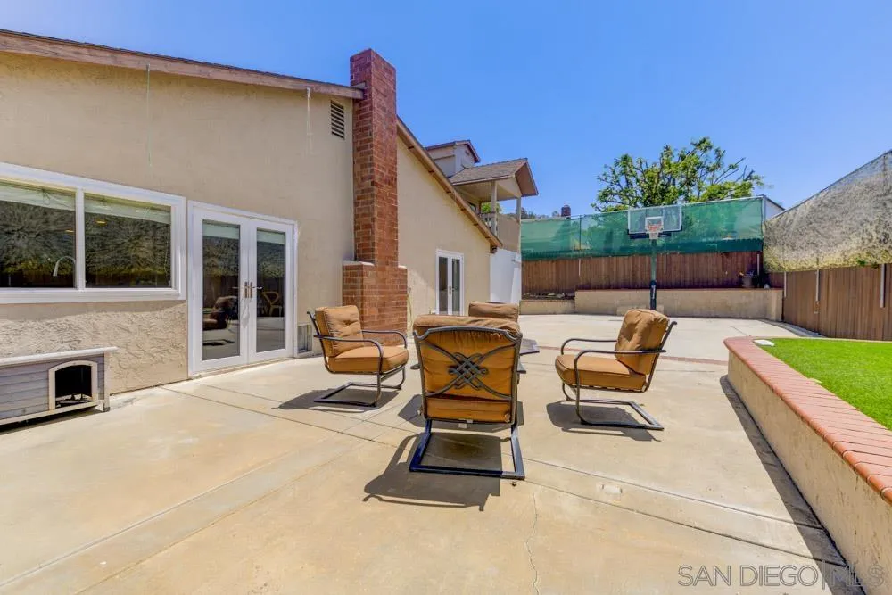 13008 Acton Avenue Poway, CA 92064 - Photo 23 of 28 a view of a patio with a table and chairs