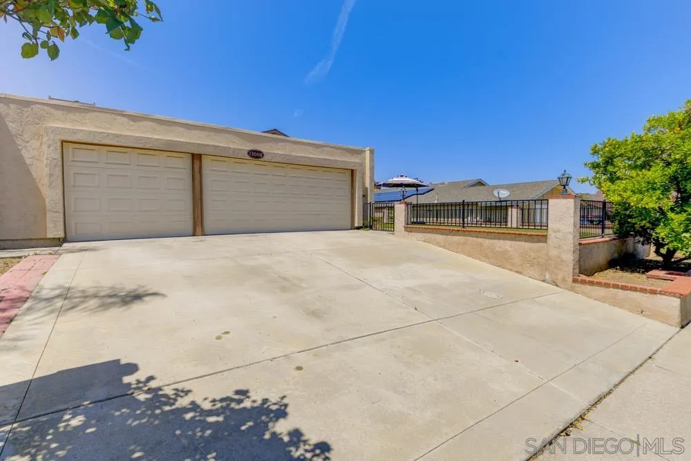 13008 Acton Avenue Poway, CA 92064 - Photo 27 of 28 a view of house with yard and garage