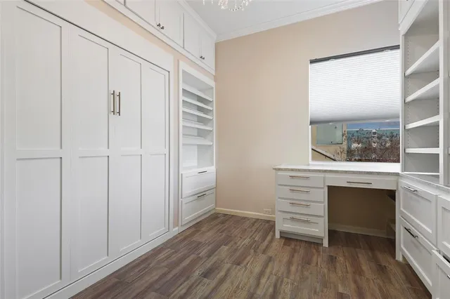 a view of room with wooden floor and window