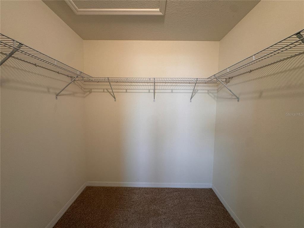 2095 King Ranch Street Kissimmee, FL 34744 - Photo 13 of 17 a view of a room with racks on the wall