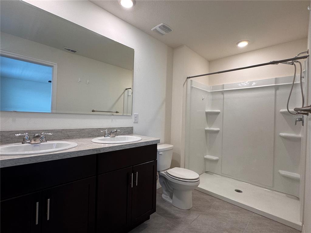 2095 King Ranch Street Kissimmee, FL 34744 - Photo 14 of 17 a bathroom with a sink toilet and shower