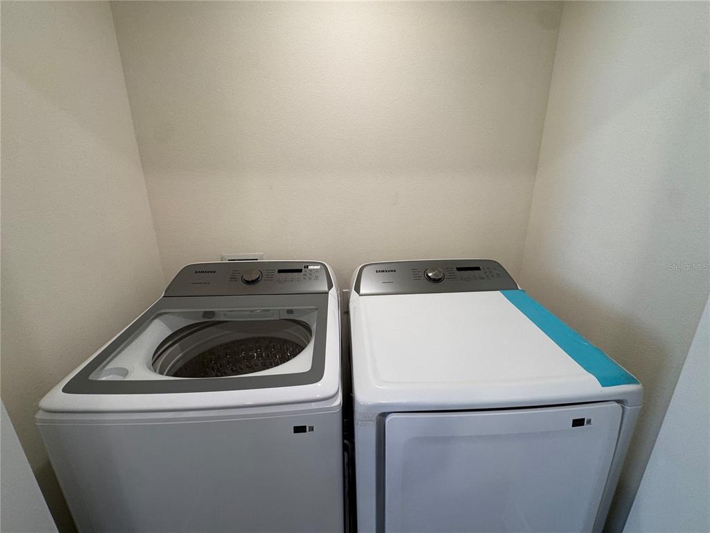 2095 King Ranch Street Kissimmee, FL 34744 - Photo 10 of 17 a utility room with dryer and washer