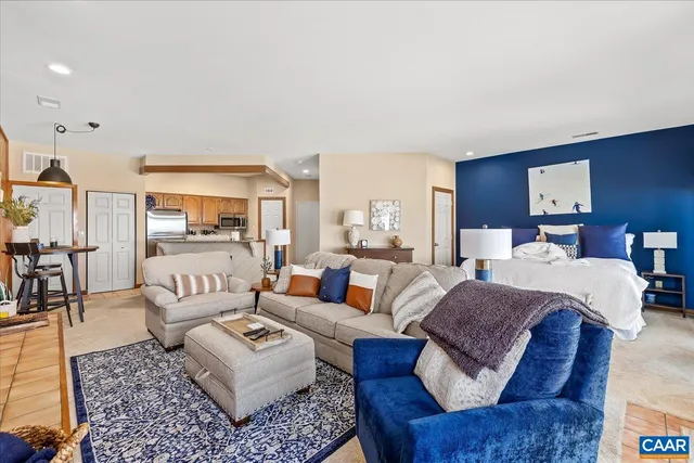 a living room with furniture and a rug