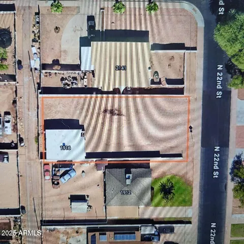 an aerial view of a house with a outdoor space