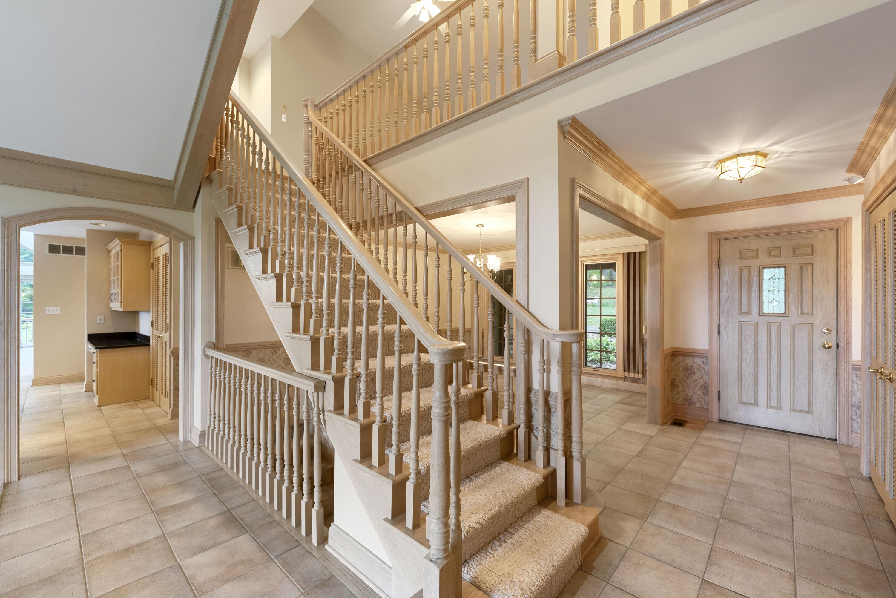 3611 West Waverly Road La Porte, IN 46350 - Photo 13 of 40 a view of staircase with lots of frames and couches