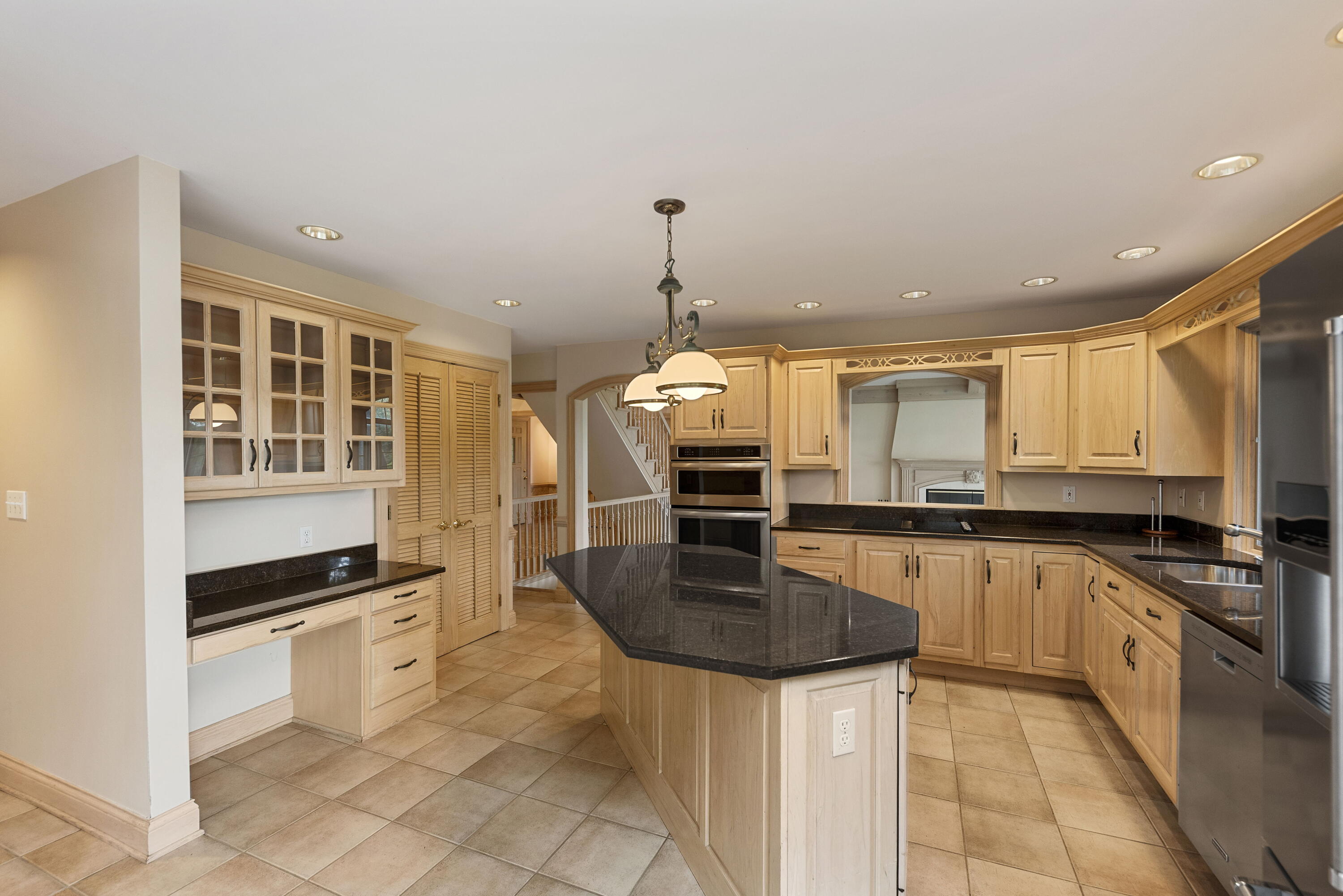 3611 West Waverly Road La Porte, IN 46350 - Photo 14 of 40 a kitchen with stainless steel appliances granite countertop a stove top oven a sink a dining table and chairs