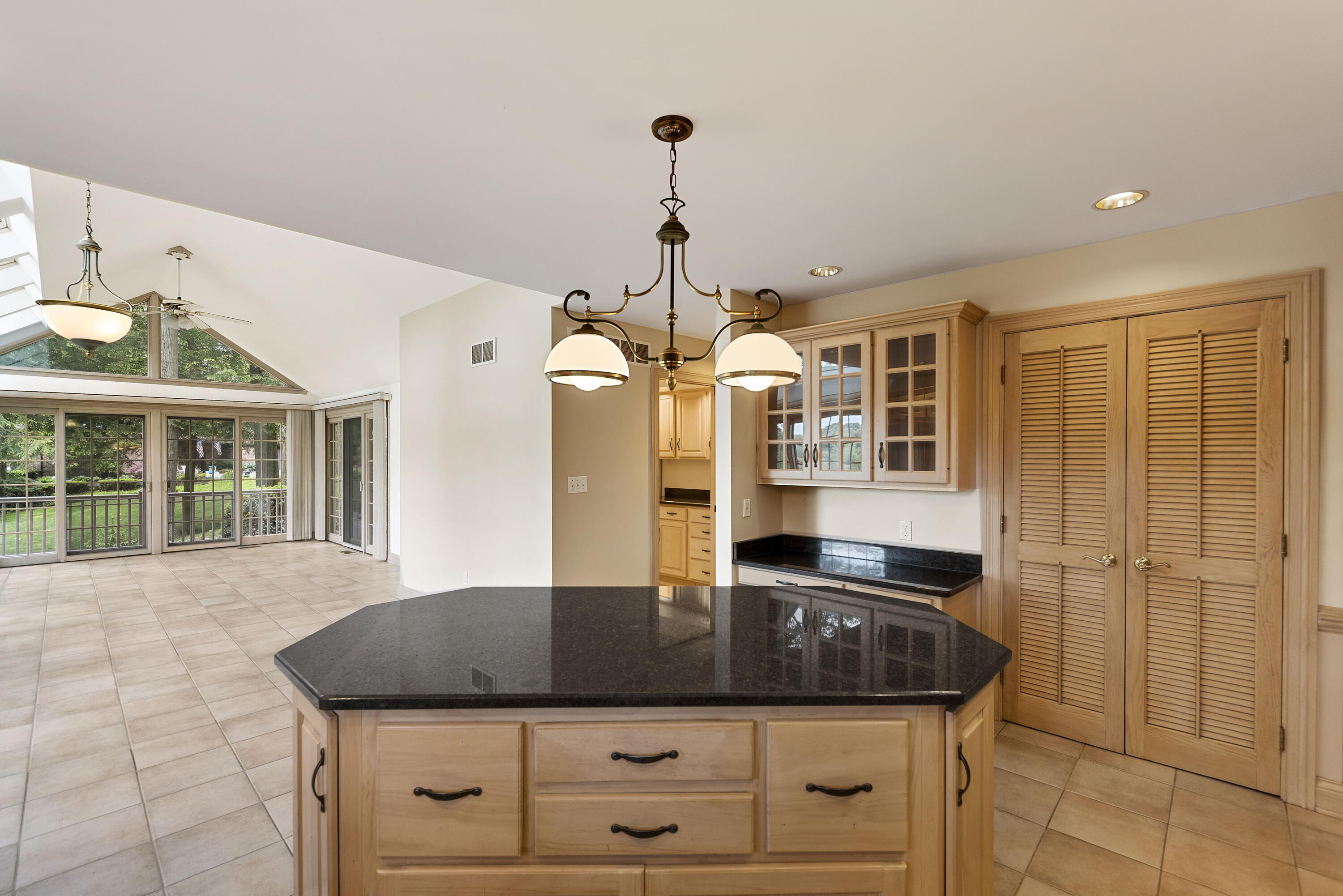 3611 West Waverly Road La Porte, IN 46350 - Photo 16 of 40 a kitchen with granite countertop a sink and a chandelier