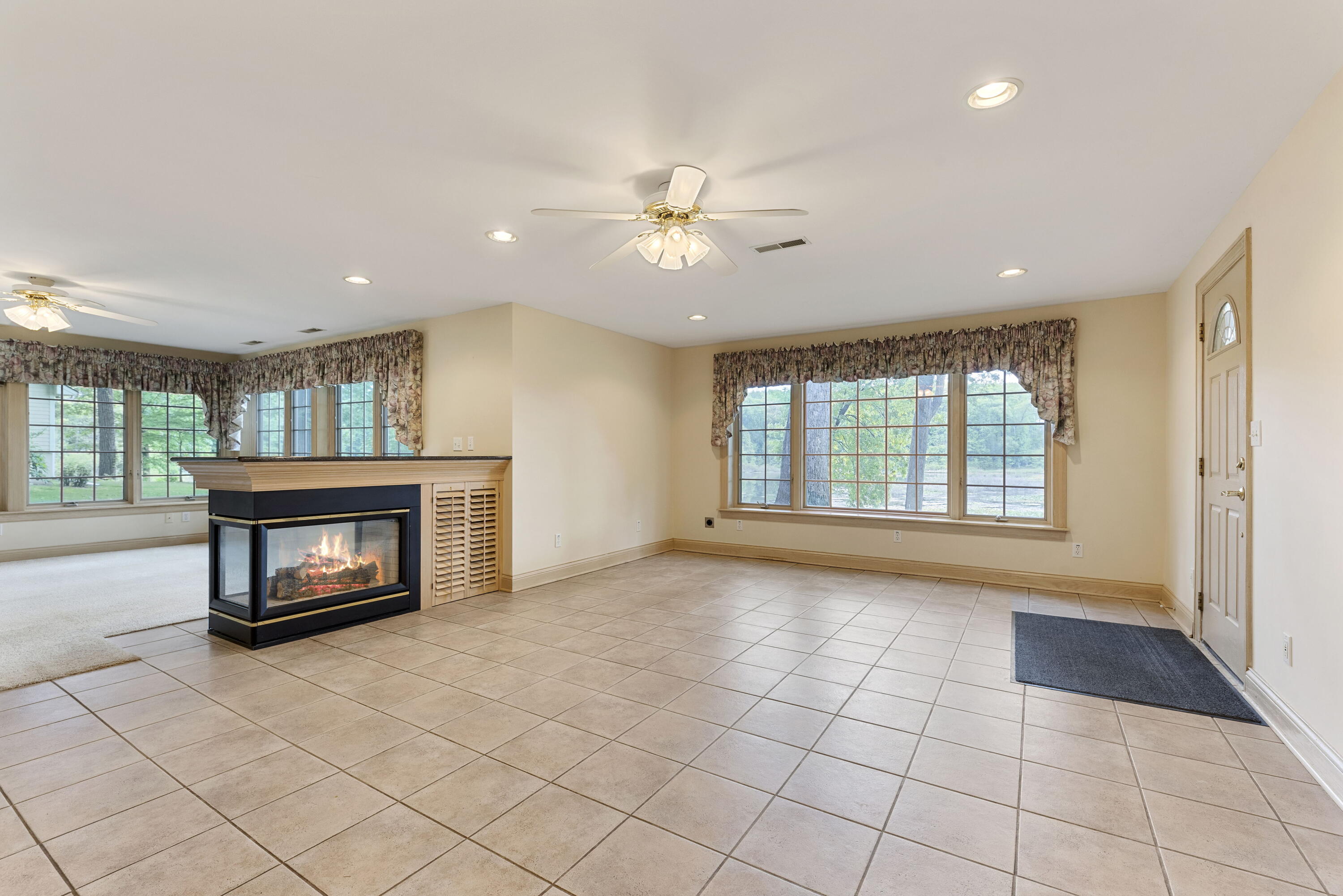 3611 West Waverly Road La Porte, IN 46350 - Photo 35 of 40 a view of an empty room with a fireplace and a window