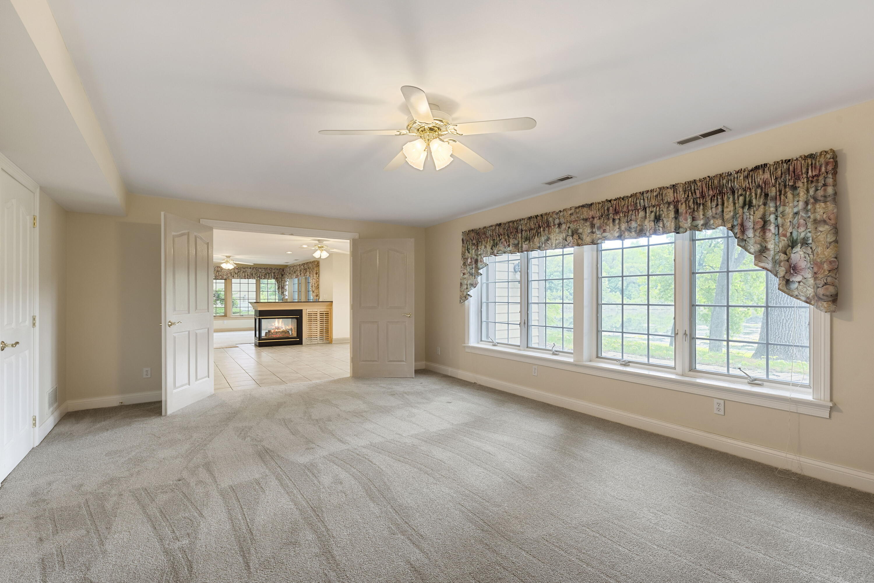 3611 West Waverly Road La Porte, IN 46350 - Photo 36 of 40 a view of a livingroom with a ceiling fan and window