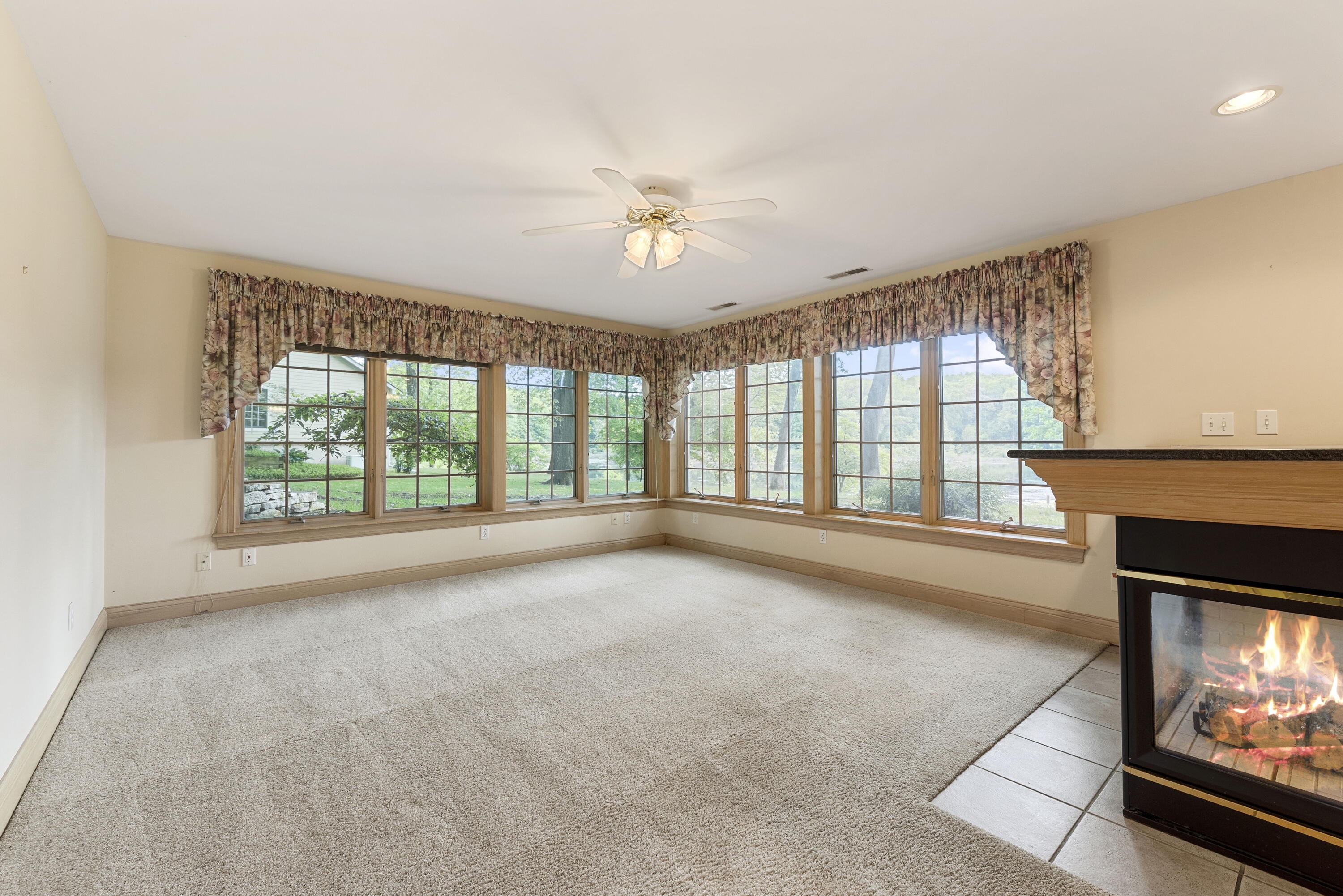 3611 West Waverly Road La Porte, IN 46350 - Photo 38 of 40 a view of an empty room with a fireplace and a window