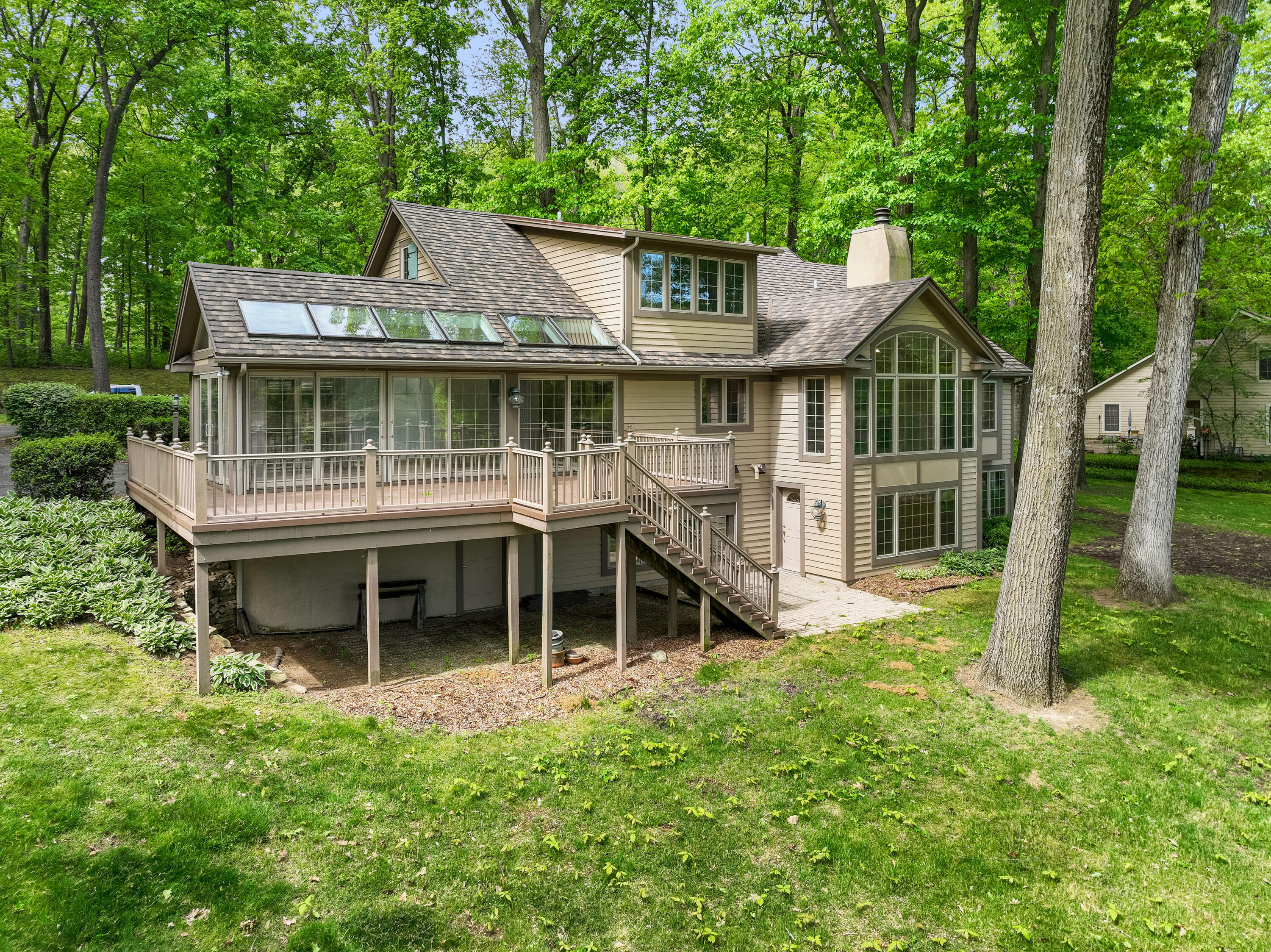 3611 West Waverly Road La Porte, IN 46350 - Photo 4 of 40 a front view of a house with a garden and deck